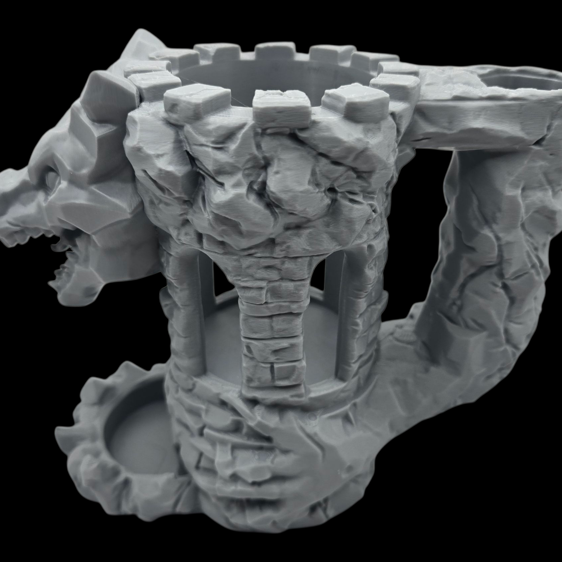 Stone-like sculpture with a central cylindrical structure on a black background