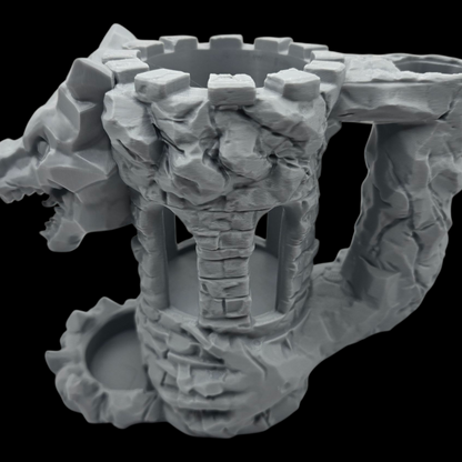 Stone-like sculpture with a central cylindrical structure on a black background