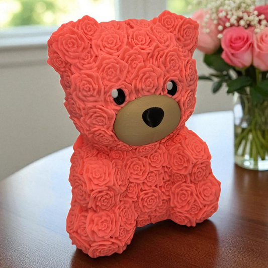 Pink teddy bear made of rose petals on a wooden surface with flowers in the background